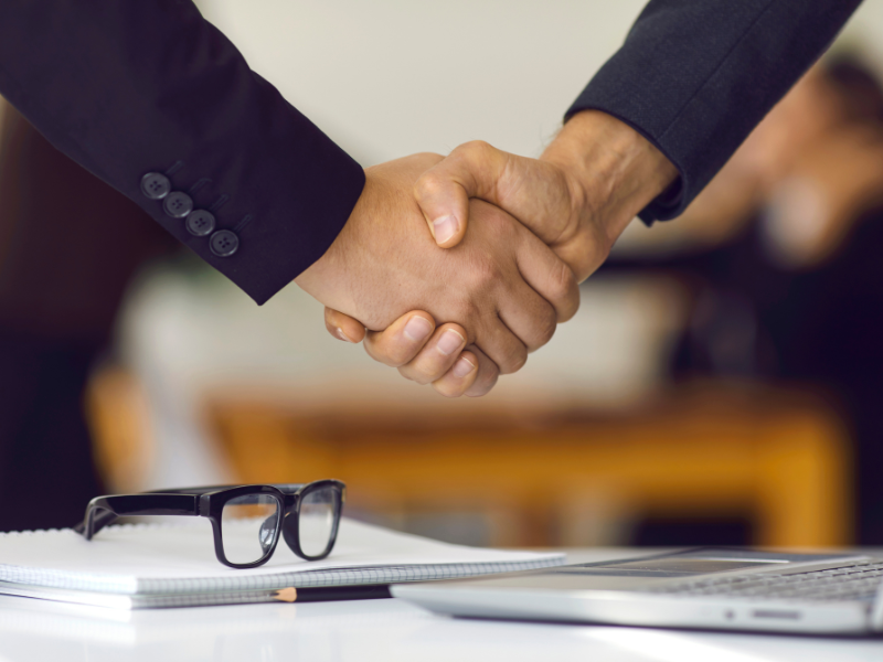 Image of a handshake symbolizing negotiation.