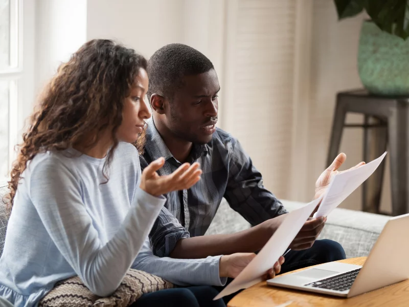 Picture of a home buyer reading through the NAR agreement.